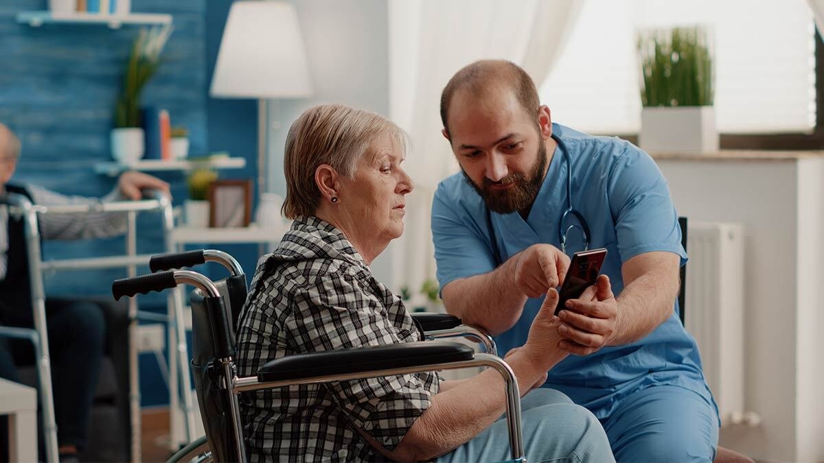 Senior-receiving-care-in-wheel-chair