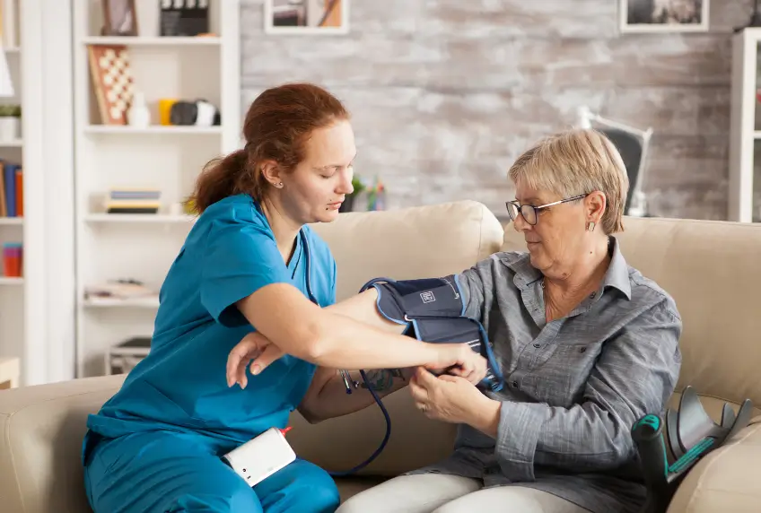 At home nurse in Toronto providing medical care such as vital signs monitoring, wound care, and patient support in a home setting.